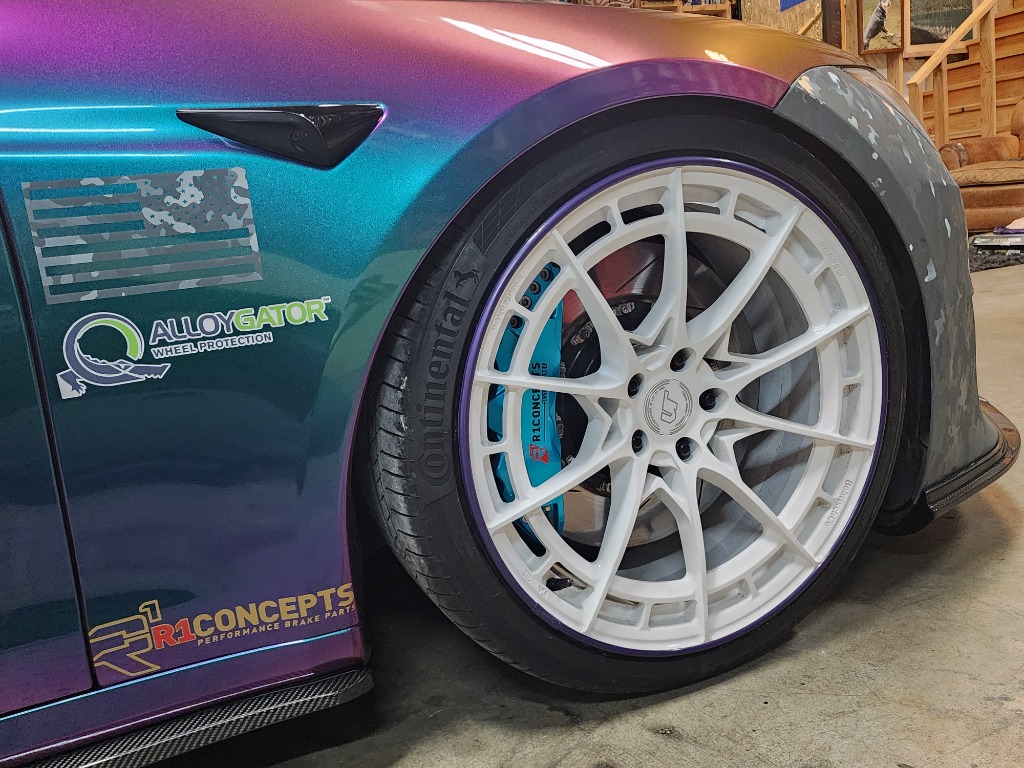 Tesla Model S charging with SafeAll™ Certified clean power unit